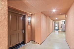 Corridor with a textured ceiling