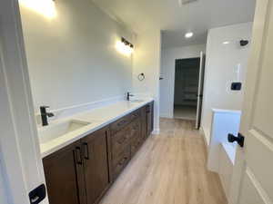 Bathroom with vanity and hardwood / wood-style flooring