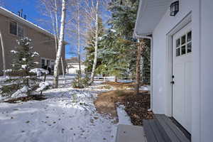 View of yard covered in snow