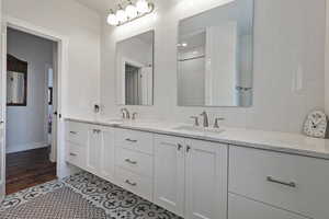 Bathroom featuring hardwood / wood-style floors and vanity