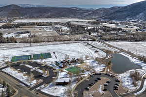 Snowy aerial view featuring a mountain view