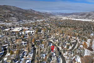 Snowy aerial view with a mountain view