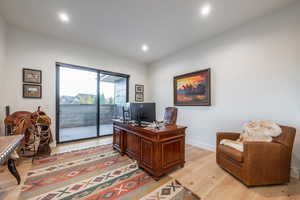 Office area with light wood-type flooring