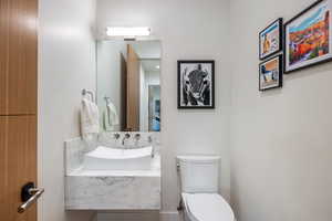 Bathroom featuring sink and toilet