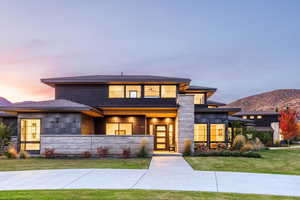 Prairie-style house with a mountain view and a yard