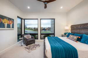 Carpeted bedroom with ceiling fan