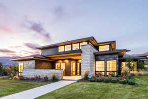 Prairie-style house featuring a yard