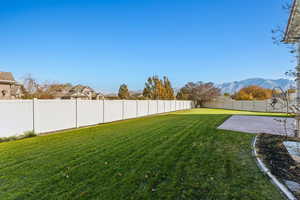 View of yard with a mountain view and a patio area