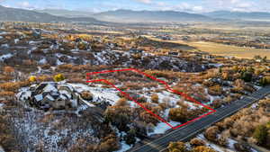 Snowy aerial view with a mountain view