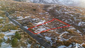 Snowy aerial view with a mountain view