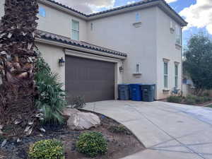 View of home's exterior with a garage