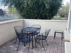 View of patio / terrace with a balcony