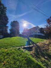 View of yard with a wooden deck