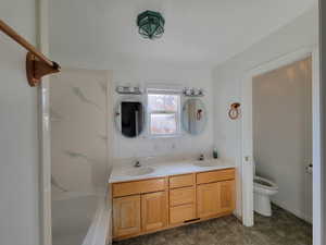 Bathroom featuring vanity and toilet