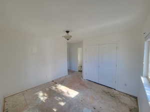 Unfurnished bedroom featuring a closet