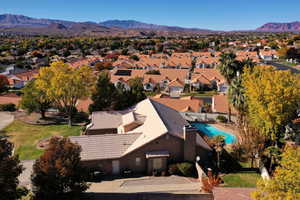 Birds eye view of property with a mountain view