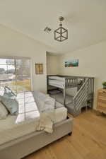 Bedroom featuring wood-type flooring and access to outside