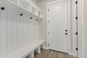 Mudroom with light wood-type flooring