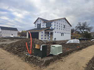 View of side of property featuring a garage