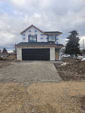 View of front of home featuring a garage