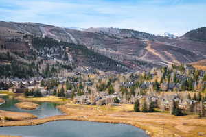 Property view of mountains with a water view