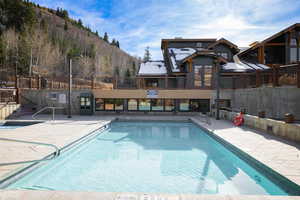 View of pool featuring a mountain view and a patio area