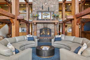 Living room featuring a stone fireplace