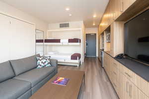 Bedroom with light wood-type flooring and recessed lighting