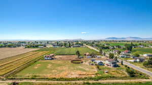 Birds eye view of property with a mountain view and a rural view