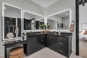 Bathroom featuring tile patterned floors and vanity