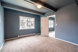 main floor bedroom with door to vanity/closet area and door to family room