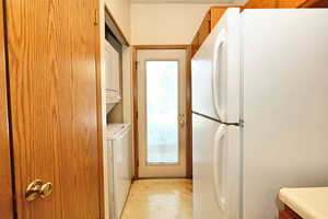 Clothes washing area with stacked washer / drying machine