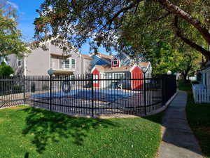 View of pool featuring a yard