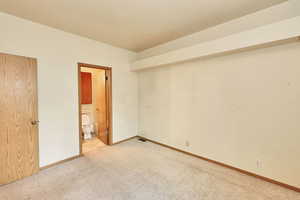 Unfurnished room with carpet floors