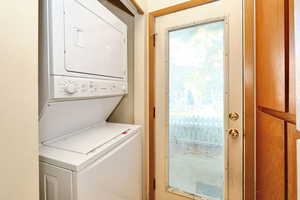 Clothes washing area with stacked washer / dryer