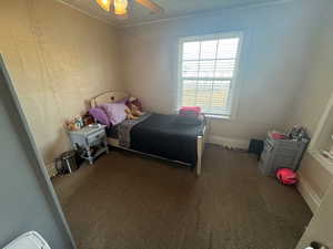 Bedroom featuring carpet and ceiling fan