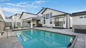 Back of house featuring outdoor lounge area and a patio area