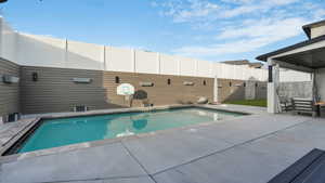 View of swimming pool with a patio