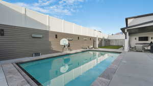 View of swimming pool featuring an outdoor living space and a patio