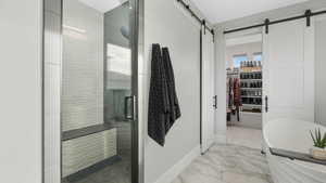 Bathroom with a shower with door