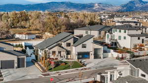 Birds eye view of property with a mountain view