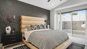 Carpeted bedroom featuring access to outside, ceiling fan, and lofted ceiling