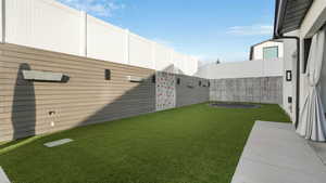 View of yard featuring a trampoline