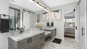 Bathroom featuring vanity and ceiling fan