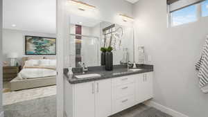 Bathroom featuring vanity and a shower with shower door