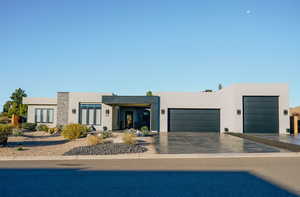 View of front of property featuring a garage