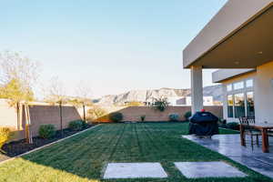 View of yard with a mountain view and a patio