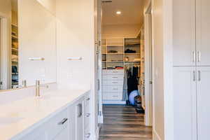 Bathroom with vanity and hardwood / wood-style flooring