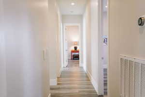 Hall featuring light wood-type flooring