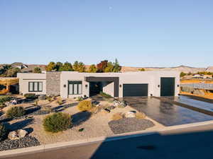 Contemporary home with a mountain view and a garage